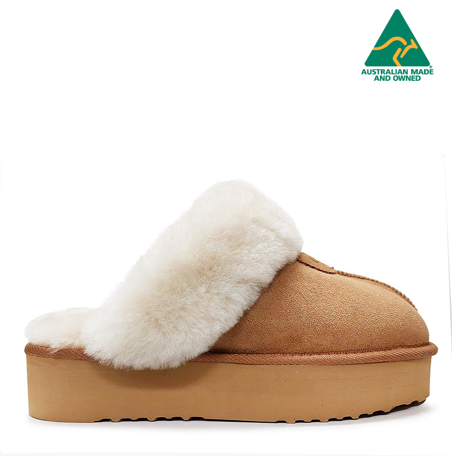 A pair of brown Charlotte Platform Ugg Boots with double faced sheepskin and a visible 4cm platform.