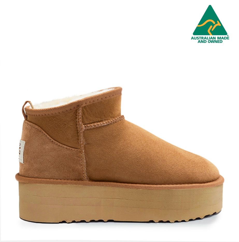 A pair of brown Joey Platform Ugg Boots with a visible heel and platform sole.