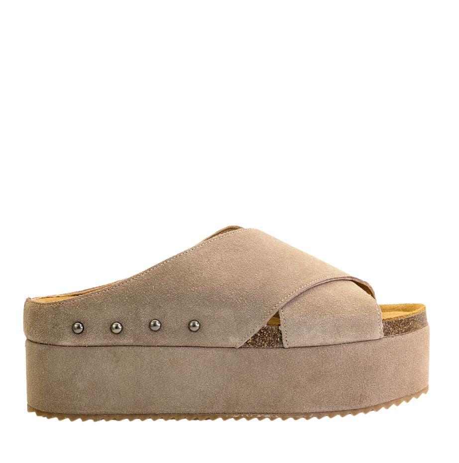 A taupe-colored platform sandal with cork bead stud details on the strap and a cork foot bed, with a rubber sole.